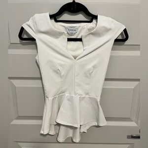 Bebe white peplum top.